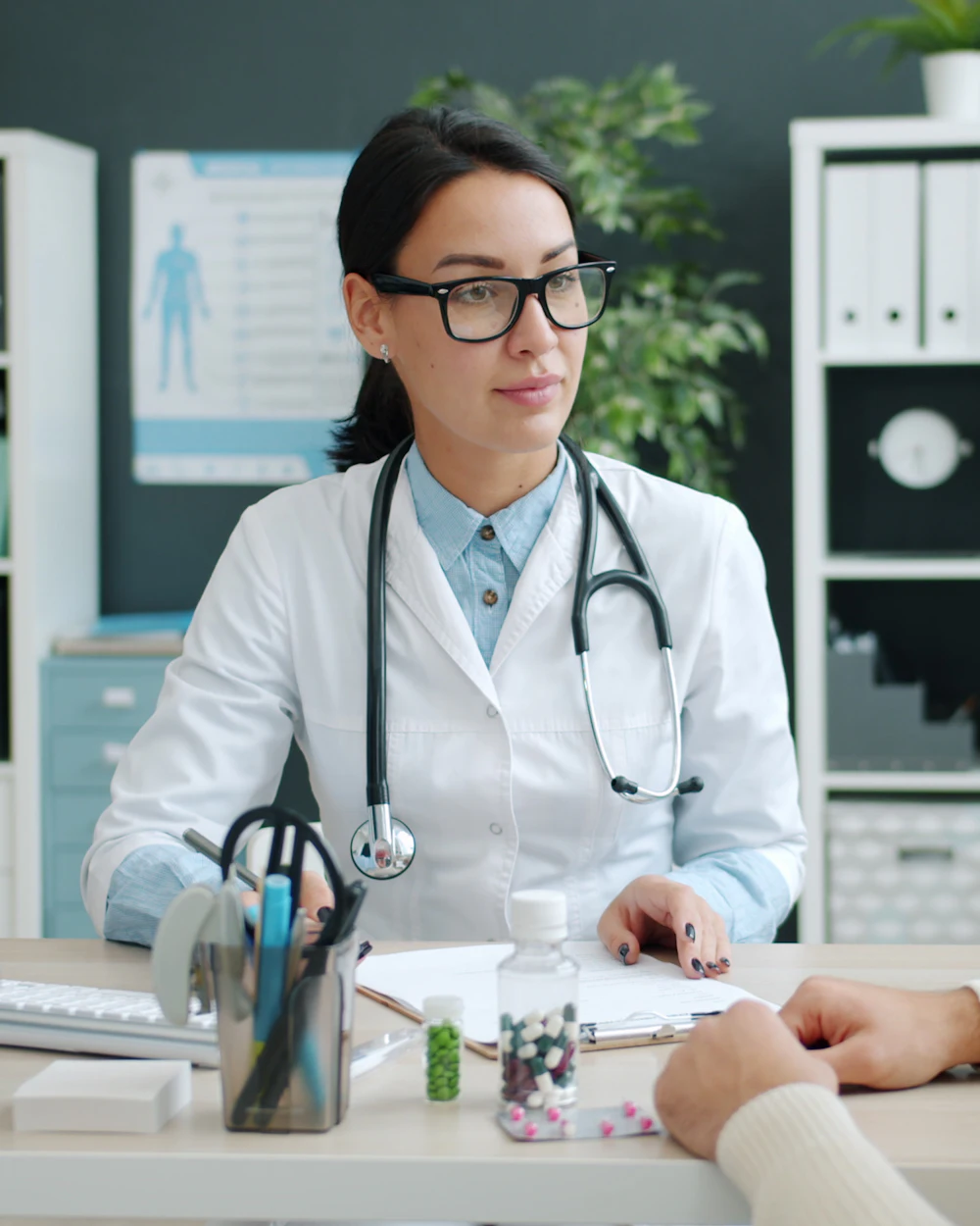 A doctor talking with a patient in a clinic office
